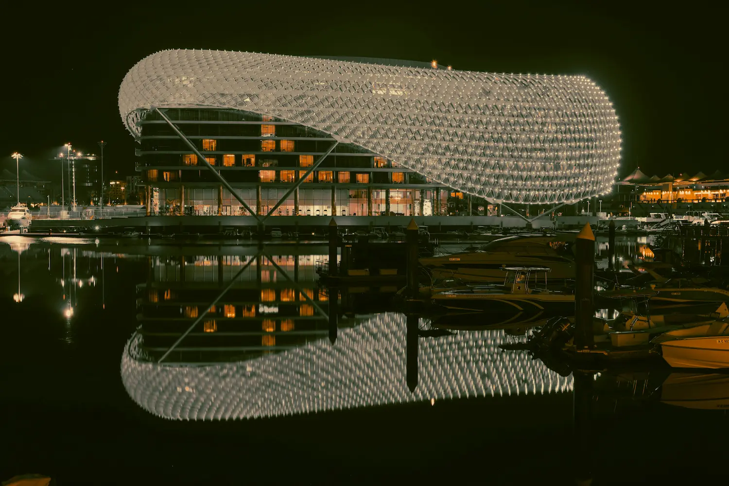 Yas Viceroy Hotel illuminated at night on Yas Island in Abu Dhabi